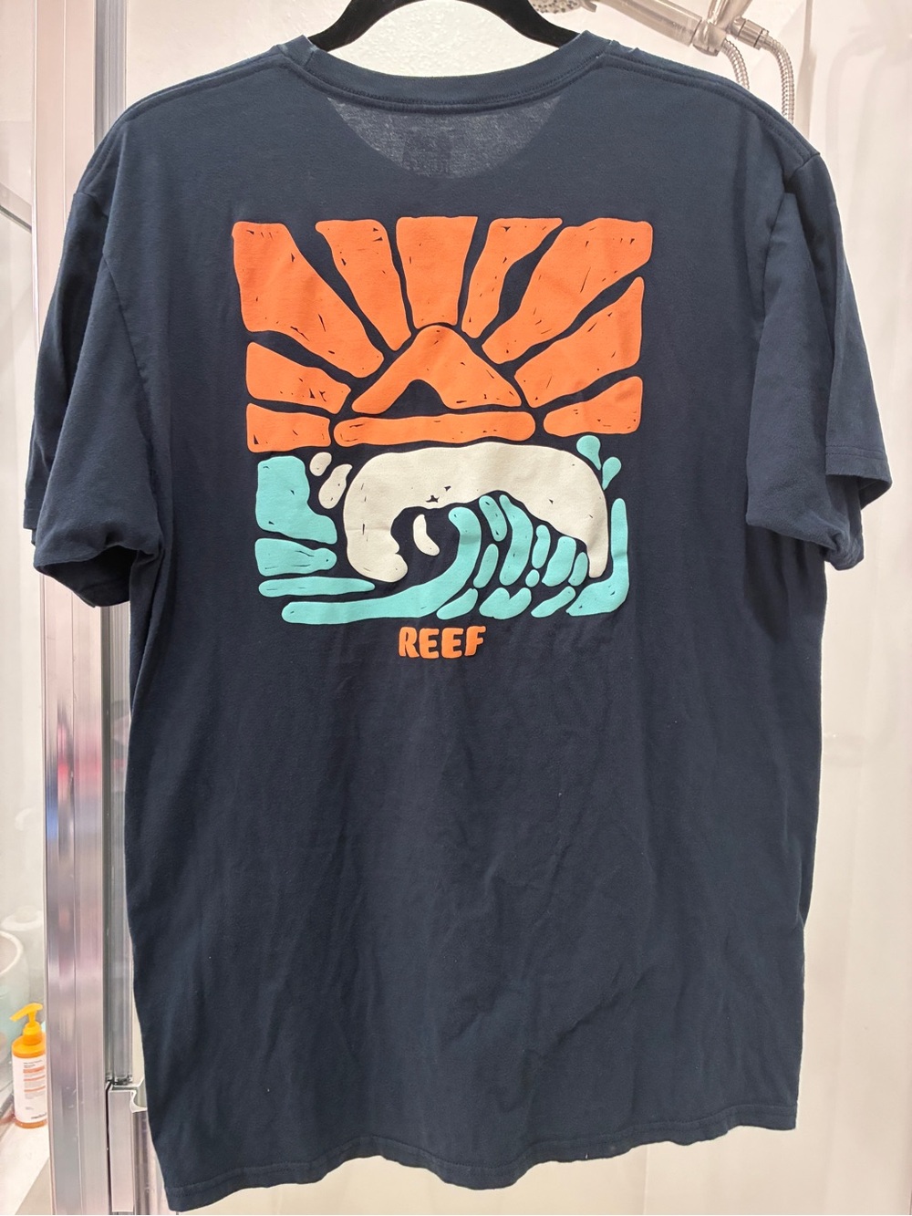 Reef Navy Short-Sleeve Tee with Orange Sun & Teal Wave Graphic